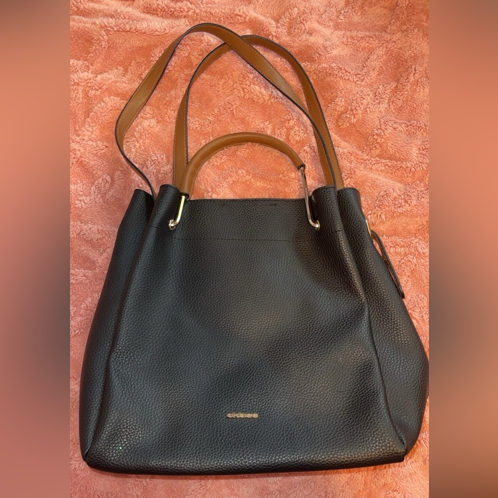 Brand new black Cklass purse with brown leather straps for hand bag or shoulder.